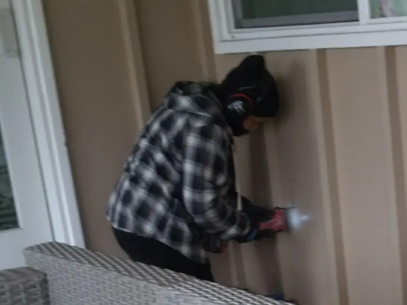 Professional electrician installing an exterior outlet in Globe